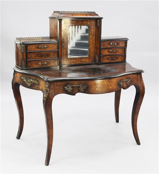 A late Victorian walnut and marquetry inlaid serpentine bonheur du jour, W.3ft 7in.